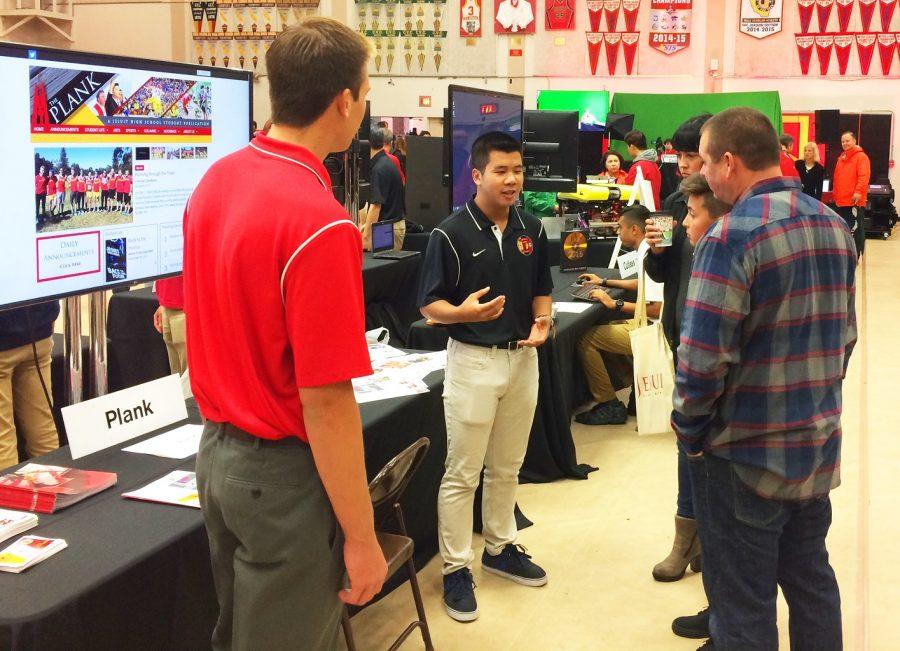 Plank Editors, Bryant and William, talk to prospective students at Open House.