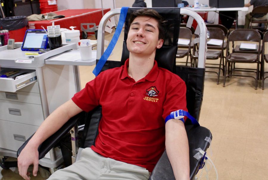 Student Carter Wink 20 participates in Jesuits annual Blood Drive. 