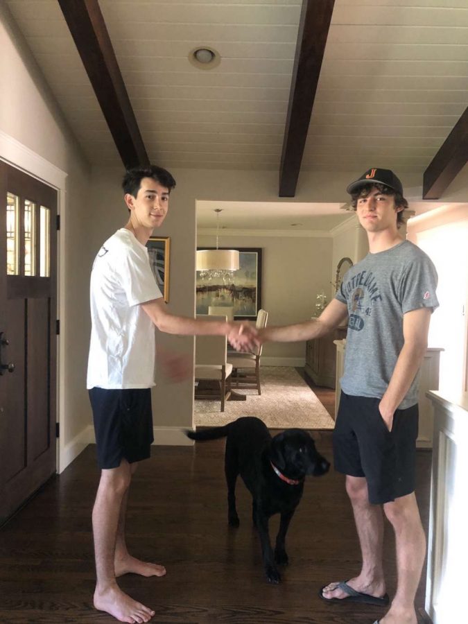 Pictured: newly appointed President Ronan Brothers 21 shaking hands with Vice President Jake Hall 21. Photo taken in February 2020 before Jesuit implemented shelter-in-place restrictions. 
