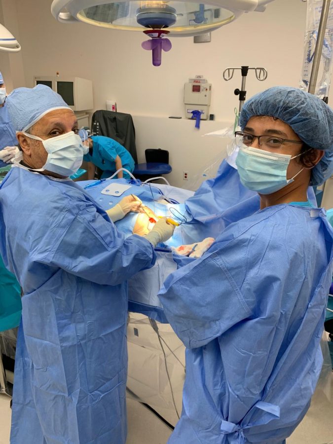 Alex Chen 21 helping on a pacemaker transplant surgery at Koreatown Surgical Clinic in July.
